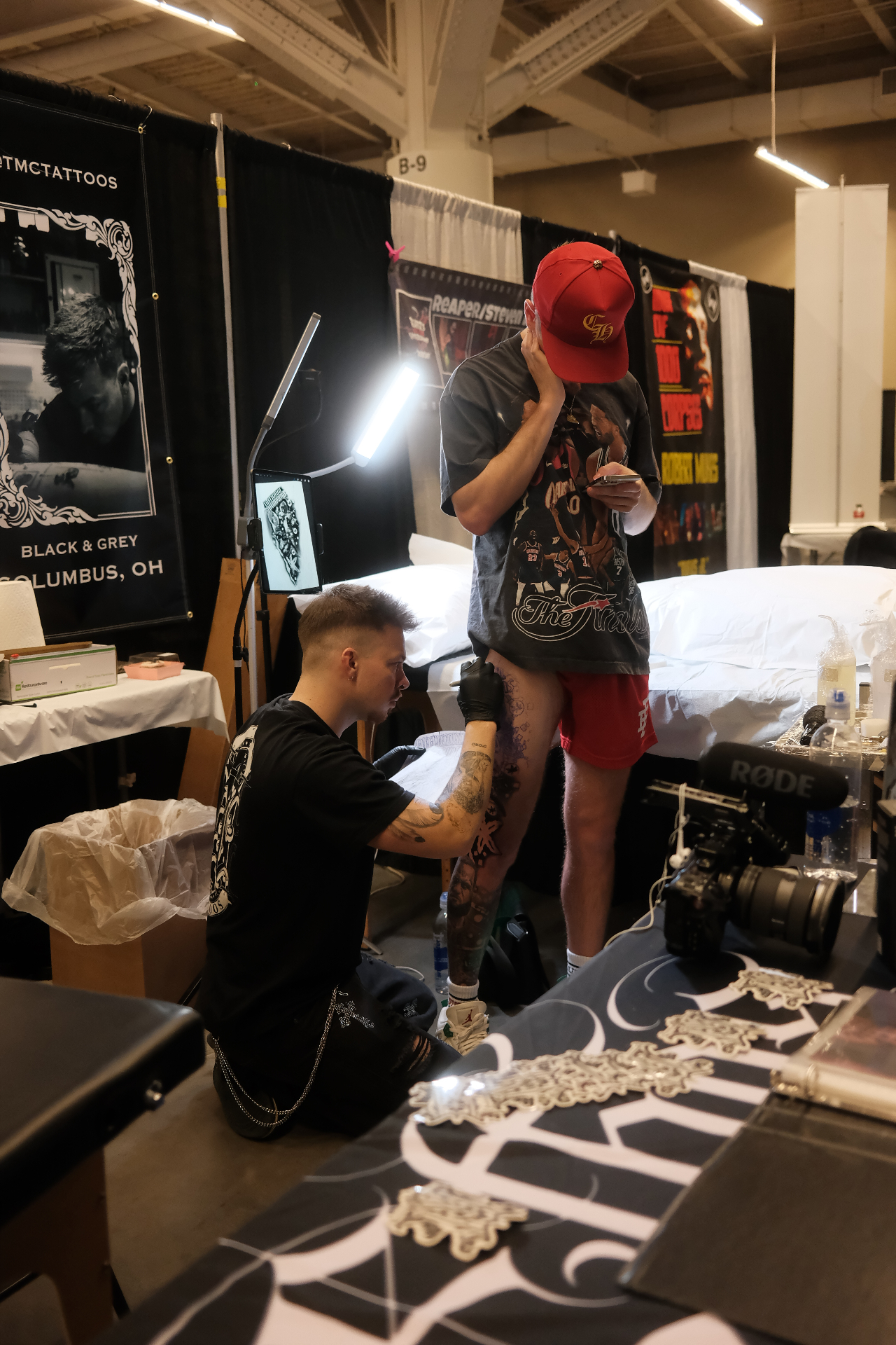 Trevor McQuade tattooing at his TMC Tattoos booth